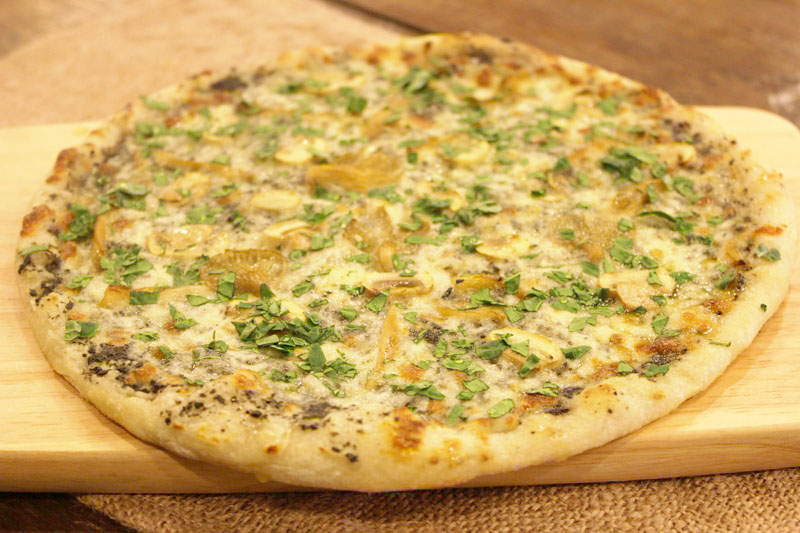 Truffle Mushroom Pizza with herbs fresh from the oven at Happy Garden Cafe